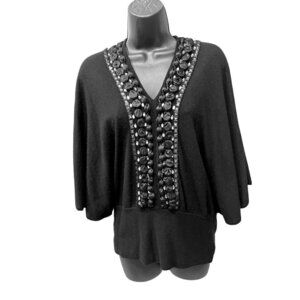 Even Design History sweater cape sleeve